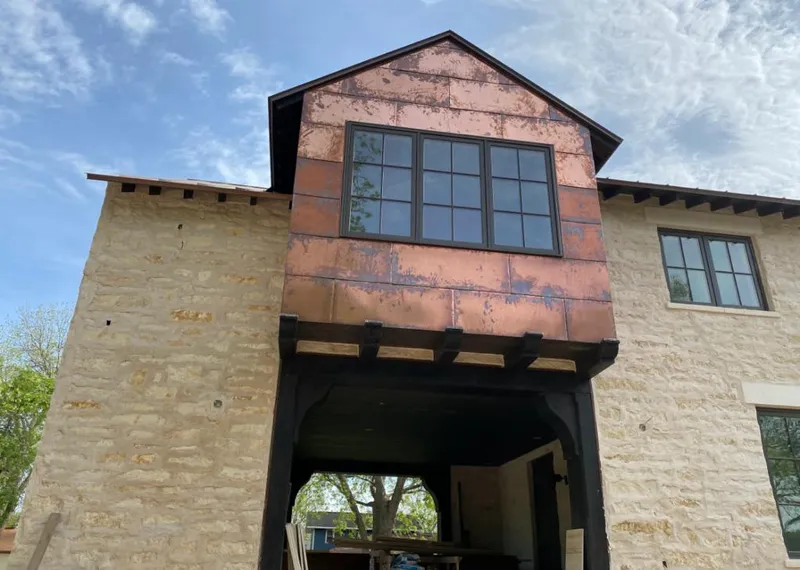 Copper metal panel facade on a stone building for Skylight Installation in Fairborn